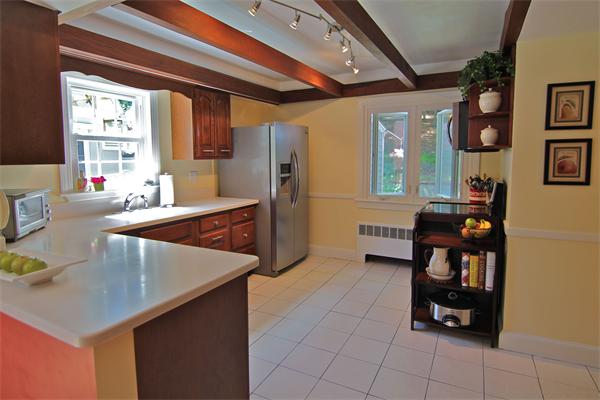 552 South Border Road Winchester, MA 01890 - Photo 8 of 19 a kitchen with stainless steel appliances kitchen island granite countertop a refrigerator and a stove