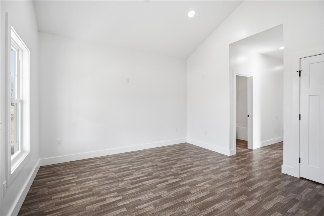 115 Riley Street Westminster, SC 29693 - Photo 5 of 46 Bright and airy, this room features durable flooring and a window offering natural light.