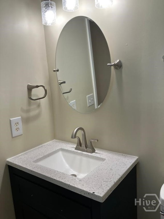 685 Rushing Street Richmond Hill, GA 31324 - Photo 13 of 34 Master bathroom with new cabinet and fancy mirror and lights