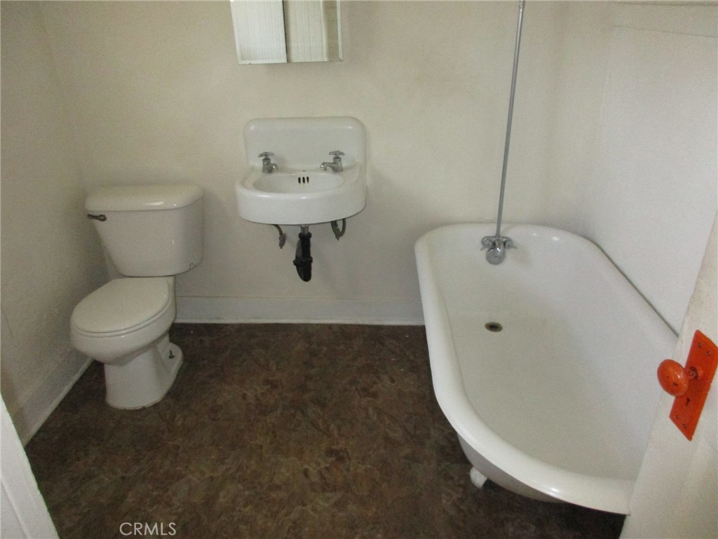 3076 Lemon Street Riverside, CA 92501 - Photo 17 of 28 a bathroom with a sink toilet and a mirror