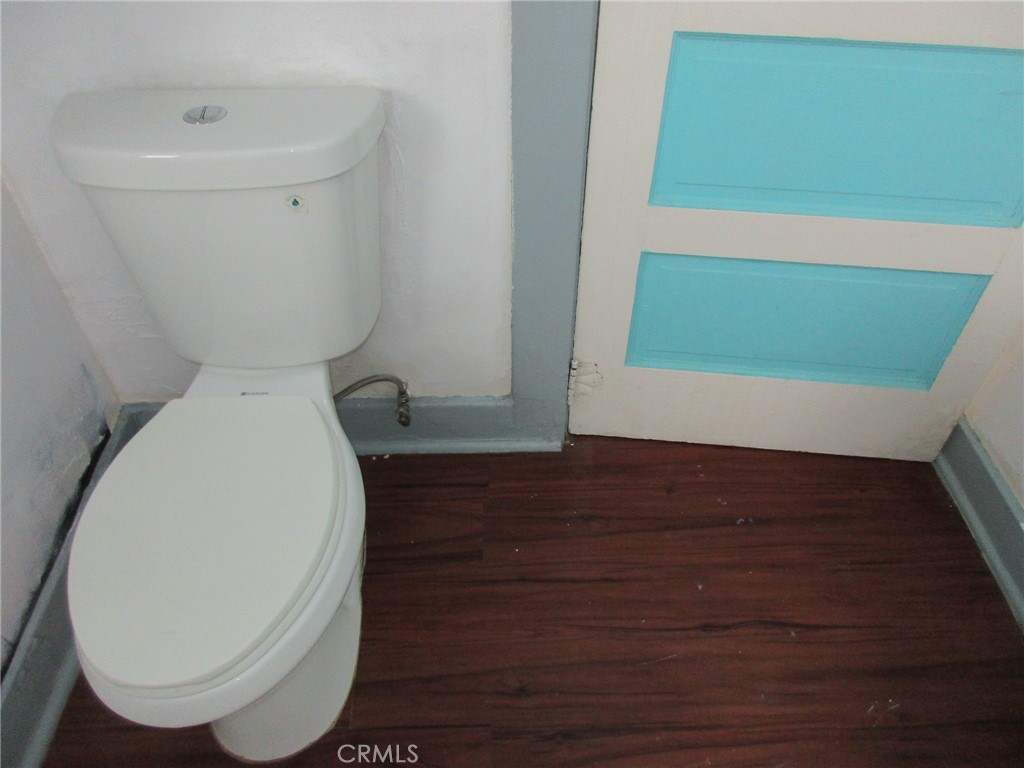 3076 Lemon Street Riverside, CA 92501 - Photo 6 of 28 a bathroom with a toilet and a sink
