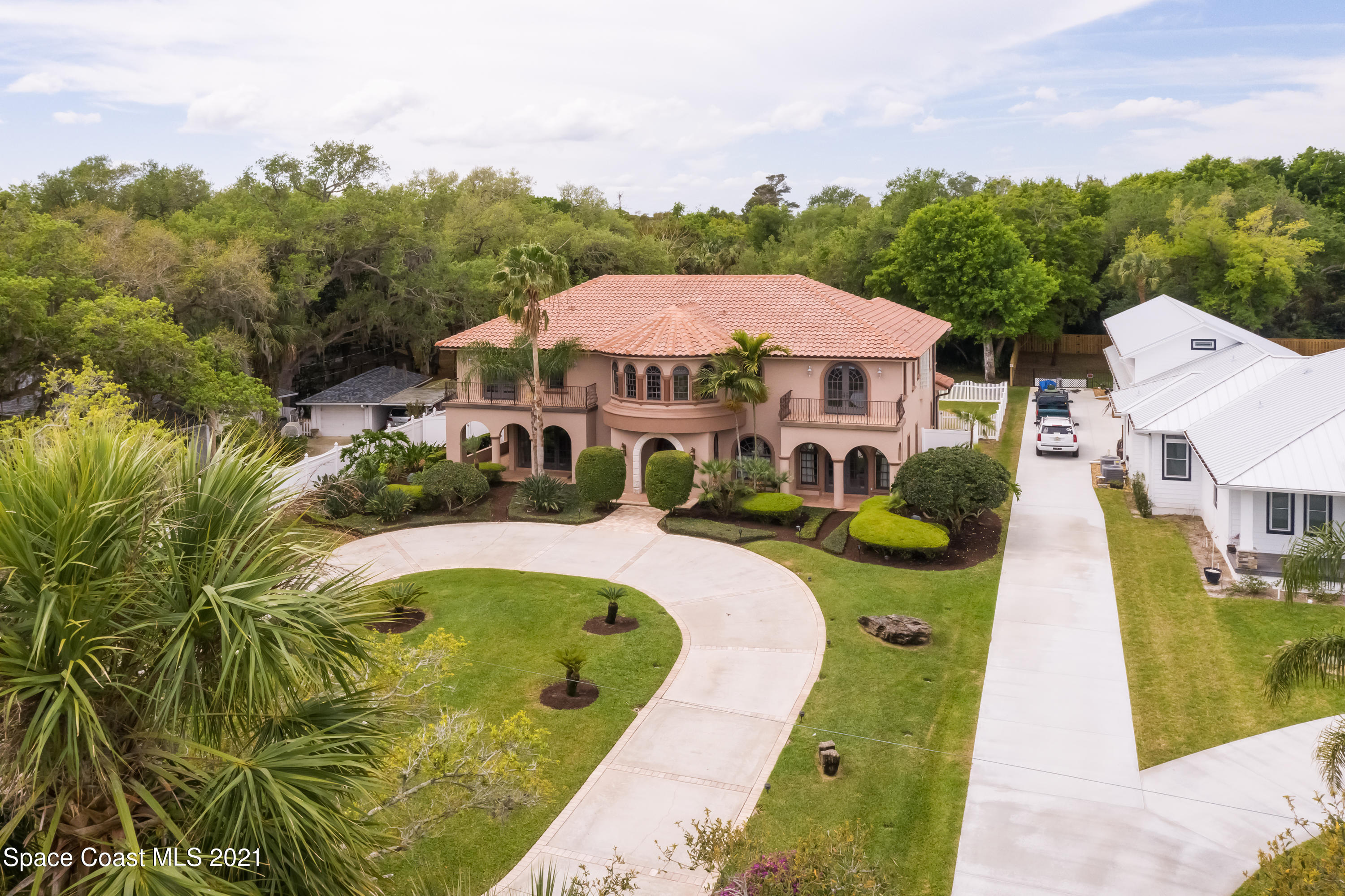 2001 Rockledge Drive Rockledge, FL 32955 - Photo 2 of 3 a view of a swimming pool with a garden and plants
