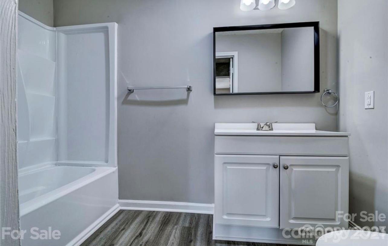 8179 Cedar Glen Drive Charlotte, NC 28212 - Photo 7 of 9 a bathroom with a bathtub and a sink
