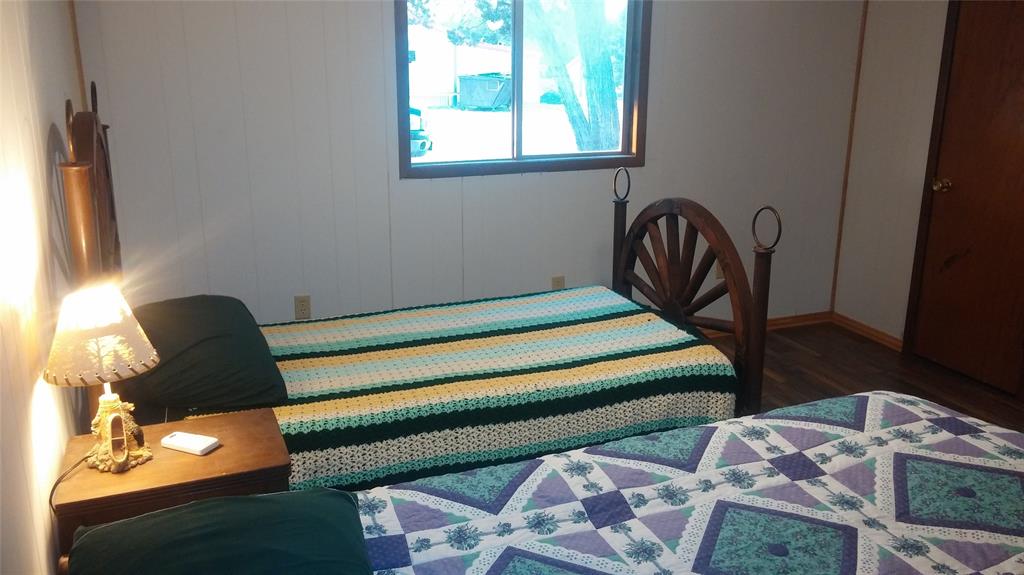 104 County Road 1296 Morgan, TX 76671 - Photo 20 of 27 a bedroom with bed and a window