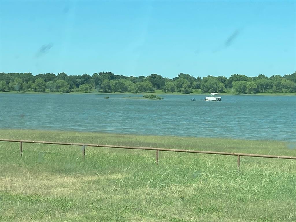 104 County Road 1296 Morgan, TX 76671 - Photo 26 of 27 a view of a lake with a yard