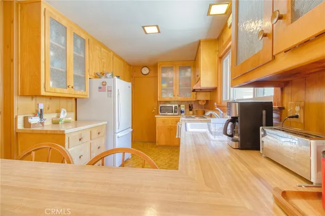 a swimming pool with outdoor seating and windows