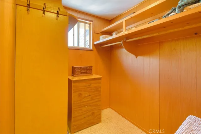 a bedroom with a bed and a lamp