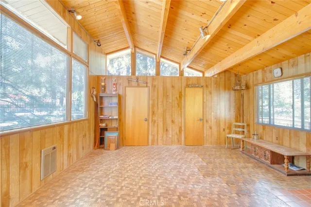 a view of balcony with wooden floor and outdoor seating