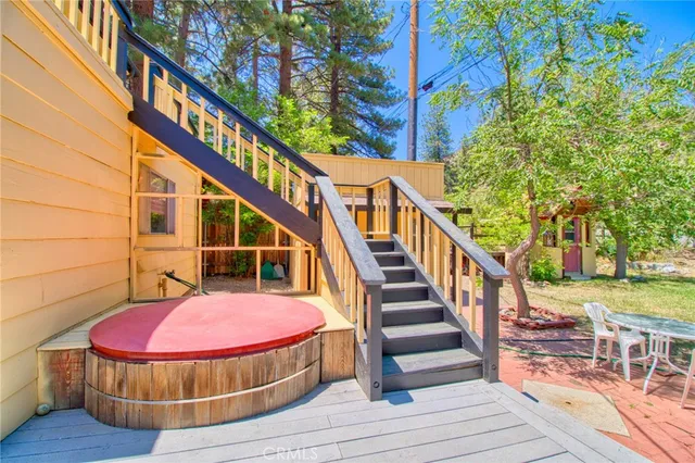 an aerial view of a house with a yard and garden