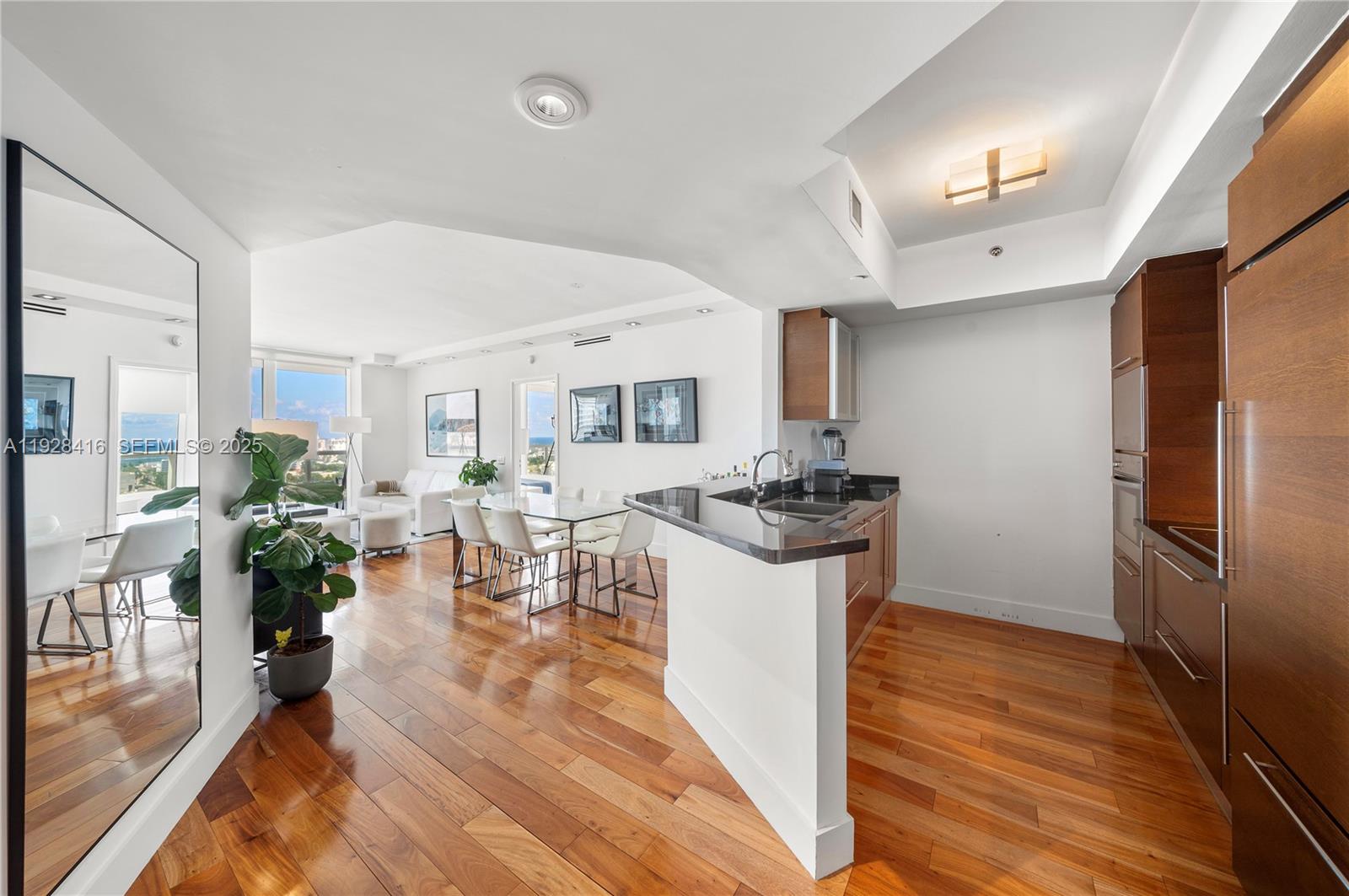 a kitchen with sink refrigerator and stove
