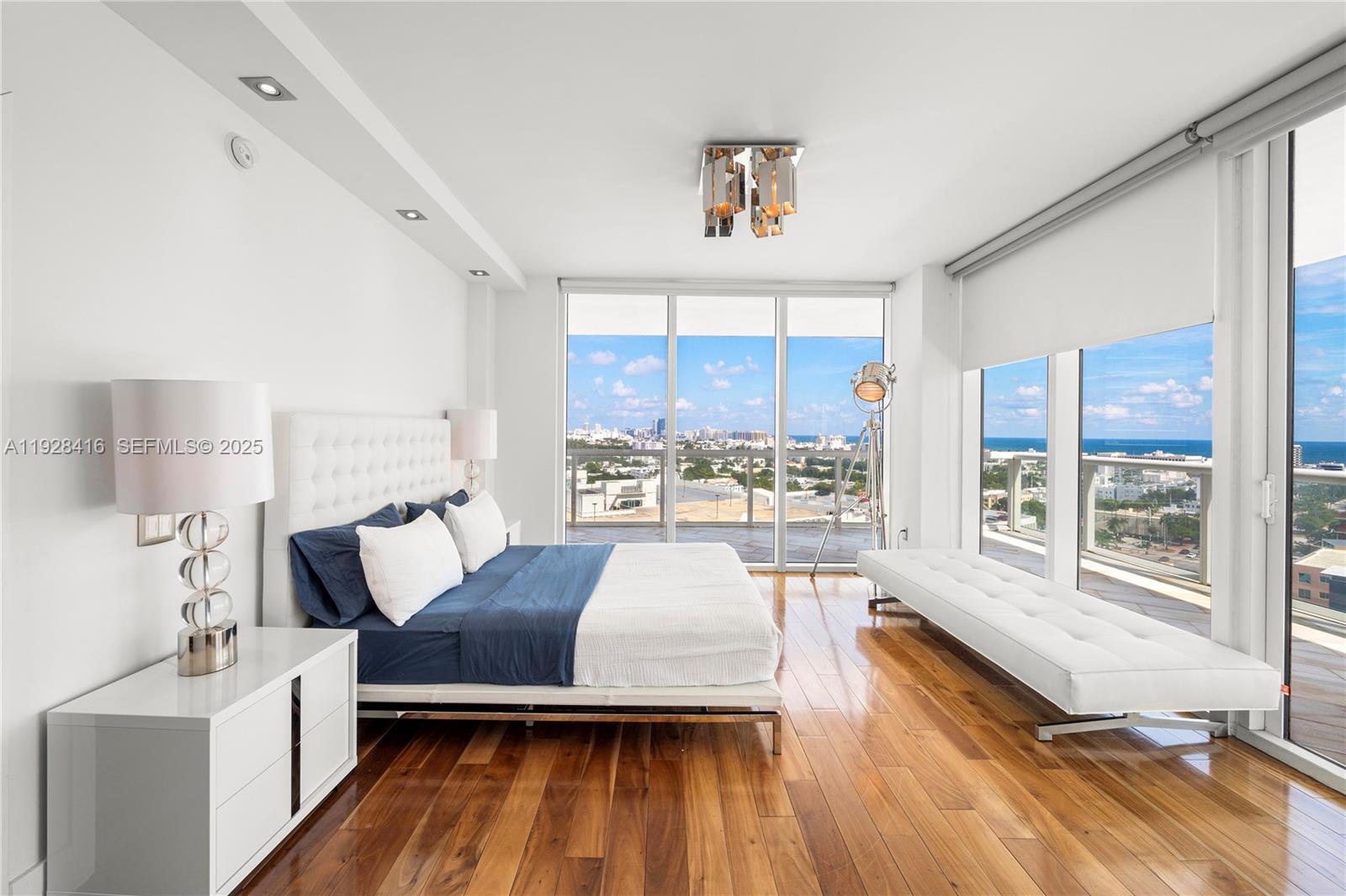 450 Alton Road, Unit 1610 Miami Beach, FL 33139 - Photo 13 of 32 a living room with furniture and a wooden floor