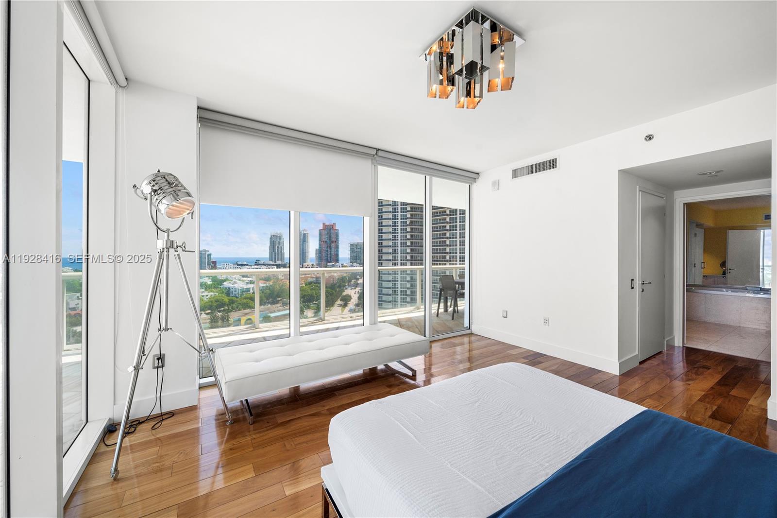 450 Alton Road, Unit 1610 Miami Beach, FL 33139 - Photo 14 of 32 a living room with furniture and a large window
