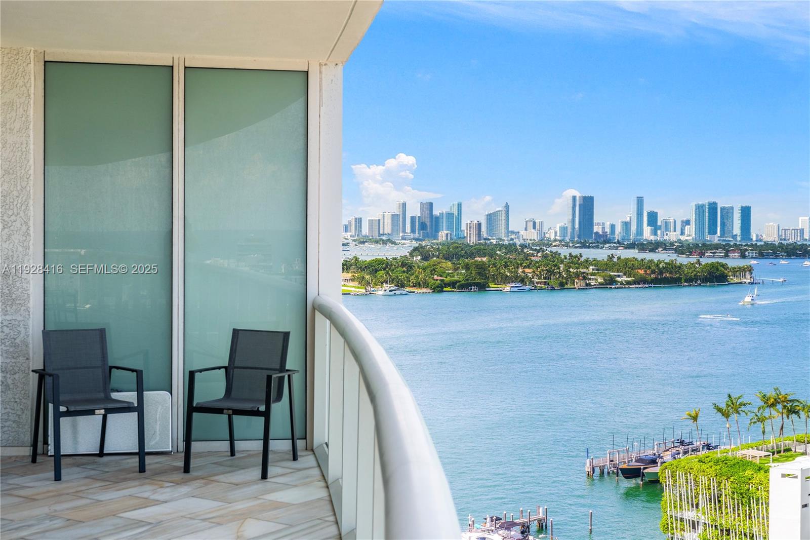 450 Alton Road, Unit 1610 Miami Beach, FL 33139 - Photo 27 of 32 a view of a terrace with chairs
