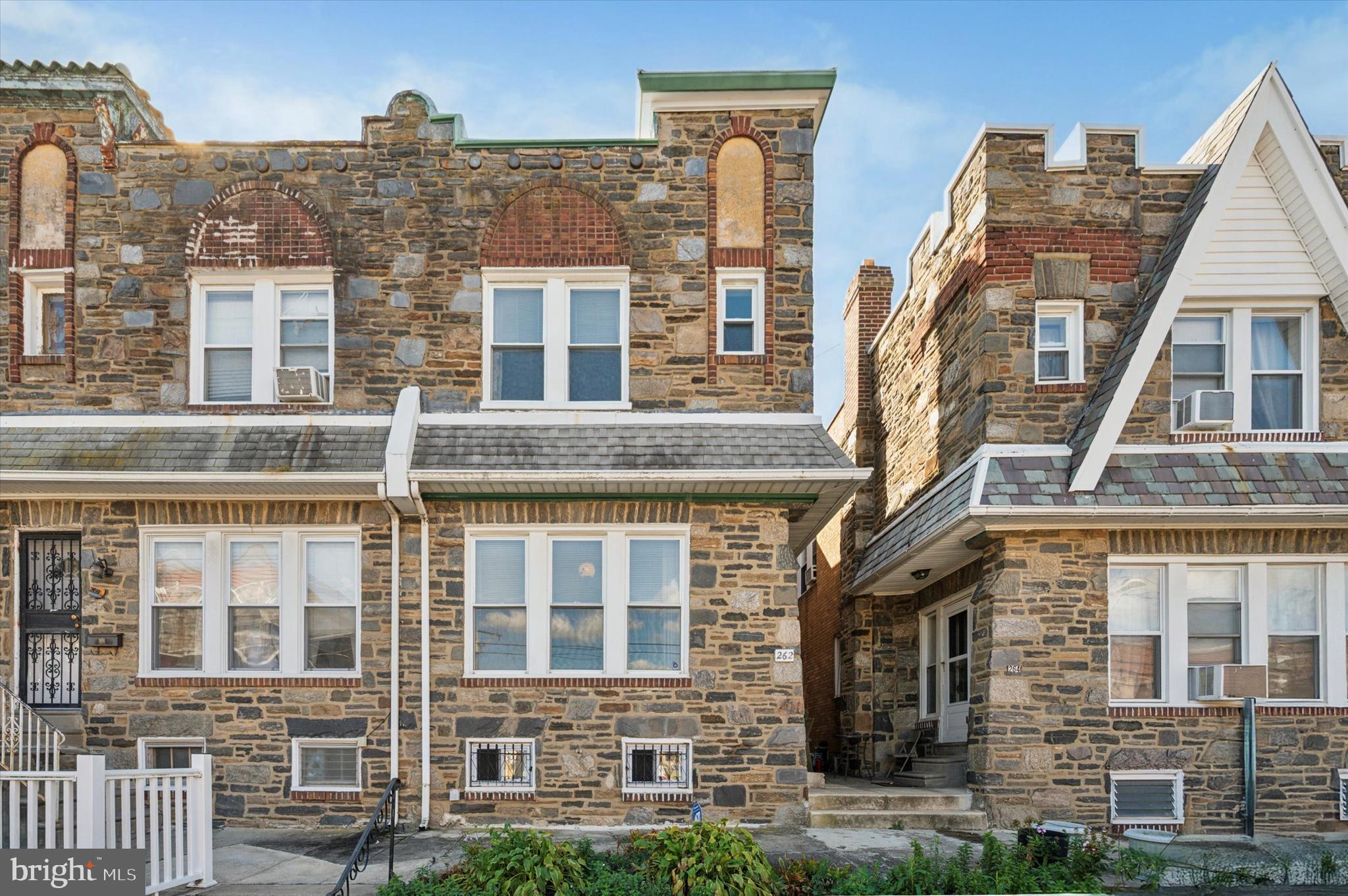 262 Bayard Road Upper Darby, PA 19082 - Photo 1 of 25 a view of a brick building next to a yard
