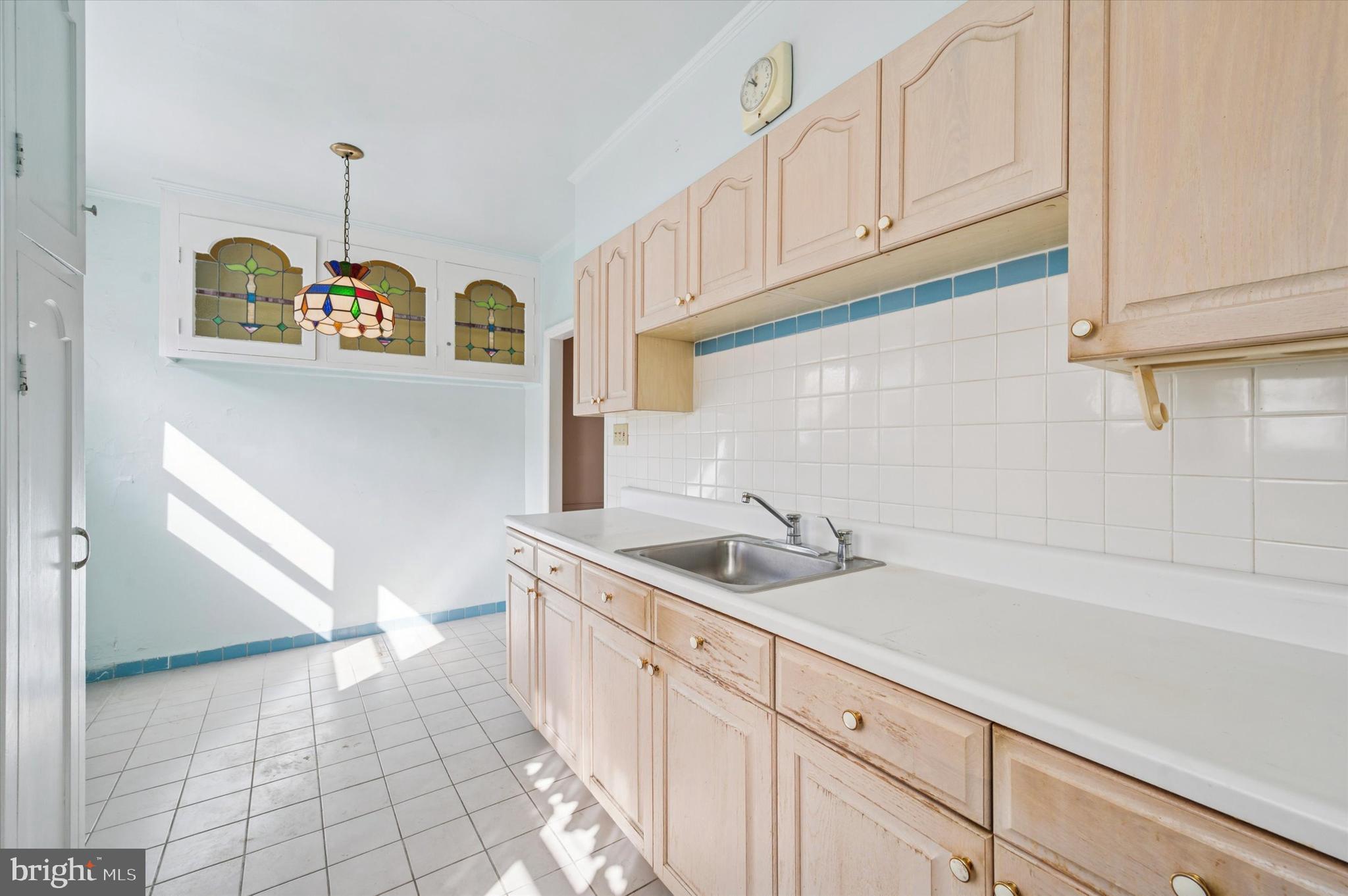 262 Bayard Road Upper Darby, PA 19082 - Photo 11 of 25 a kitchen with a sink cabinets and a window