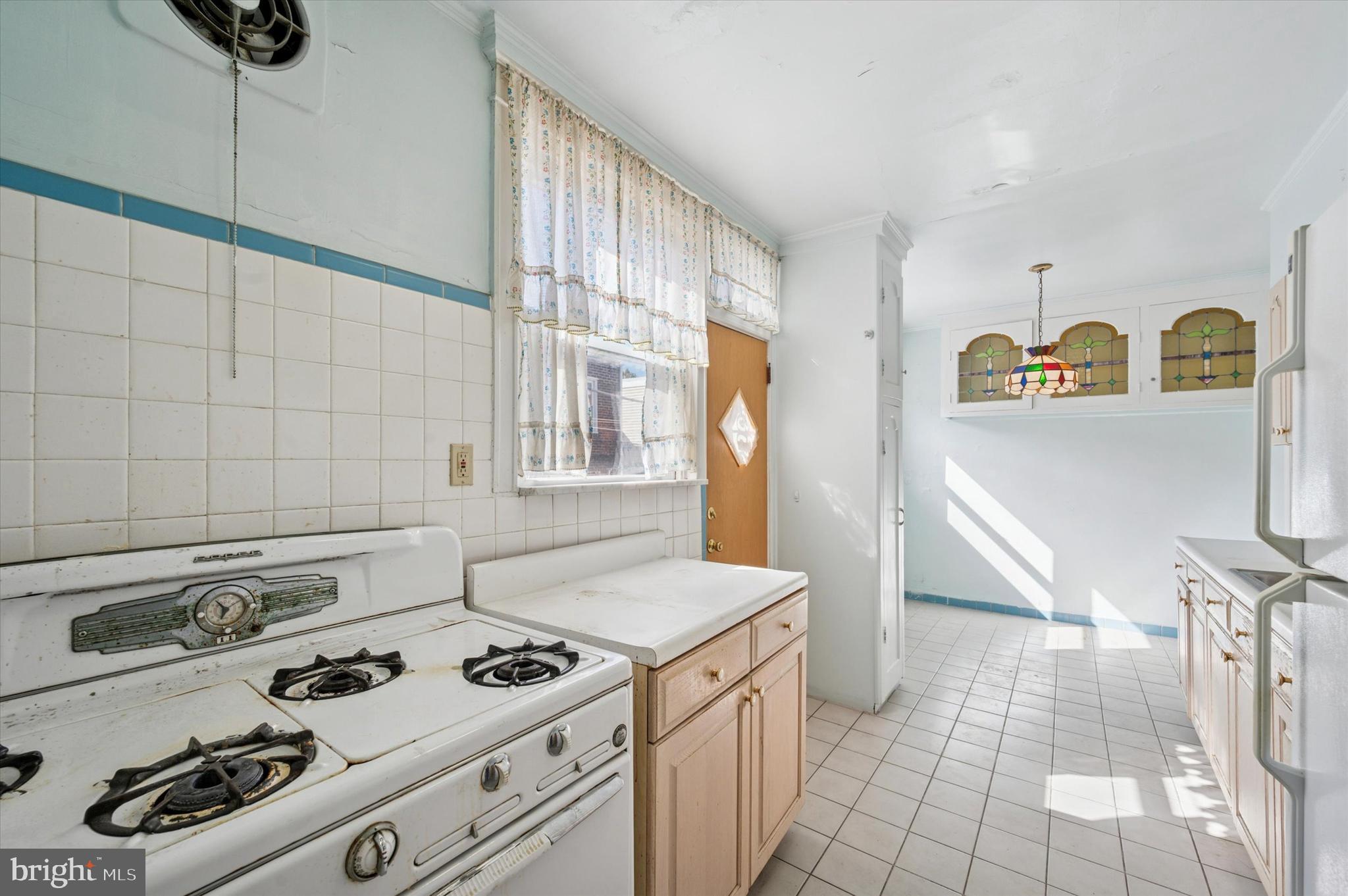 262 Bayard Road Upper Darby, PA 19082 - Photo 12 of 25 a kitchen with a stove and a refrigerator