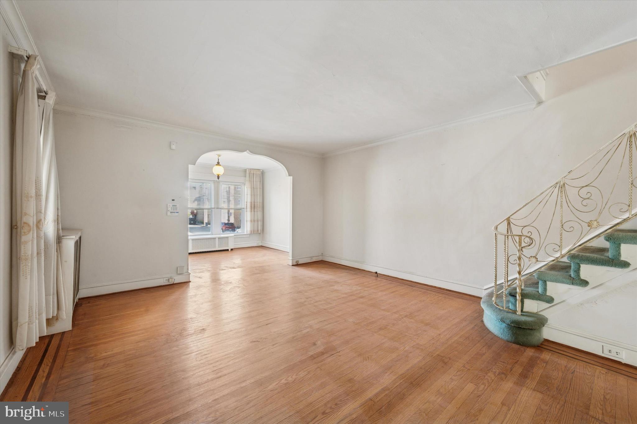 262 Bayard Road Upper Darby, PA 19082 - Photo 4 of 25 a view of an empty room with wooden floor