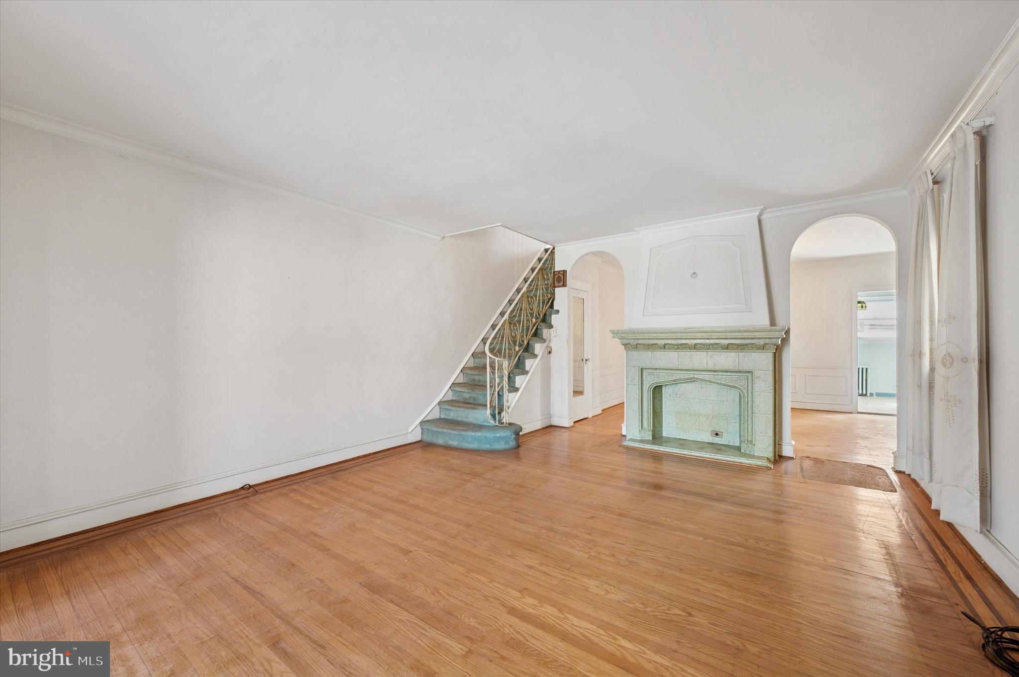 262 Bayard Road Upper Darby, PA 19082 - Photo 5 of 25 a view of an empty room with wooden floor and a window