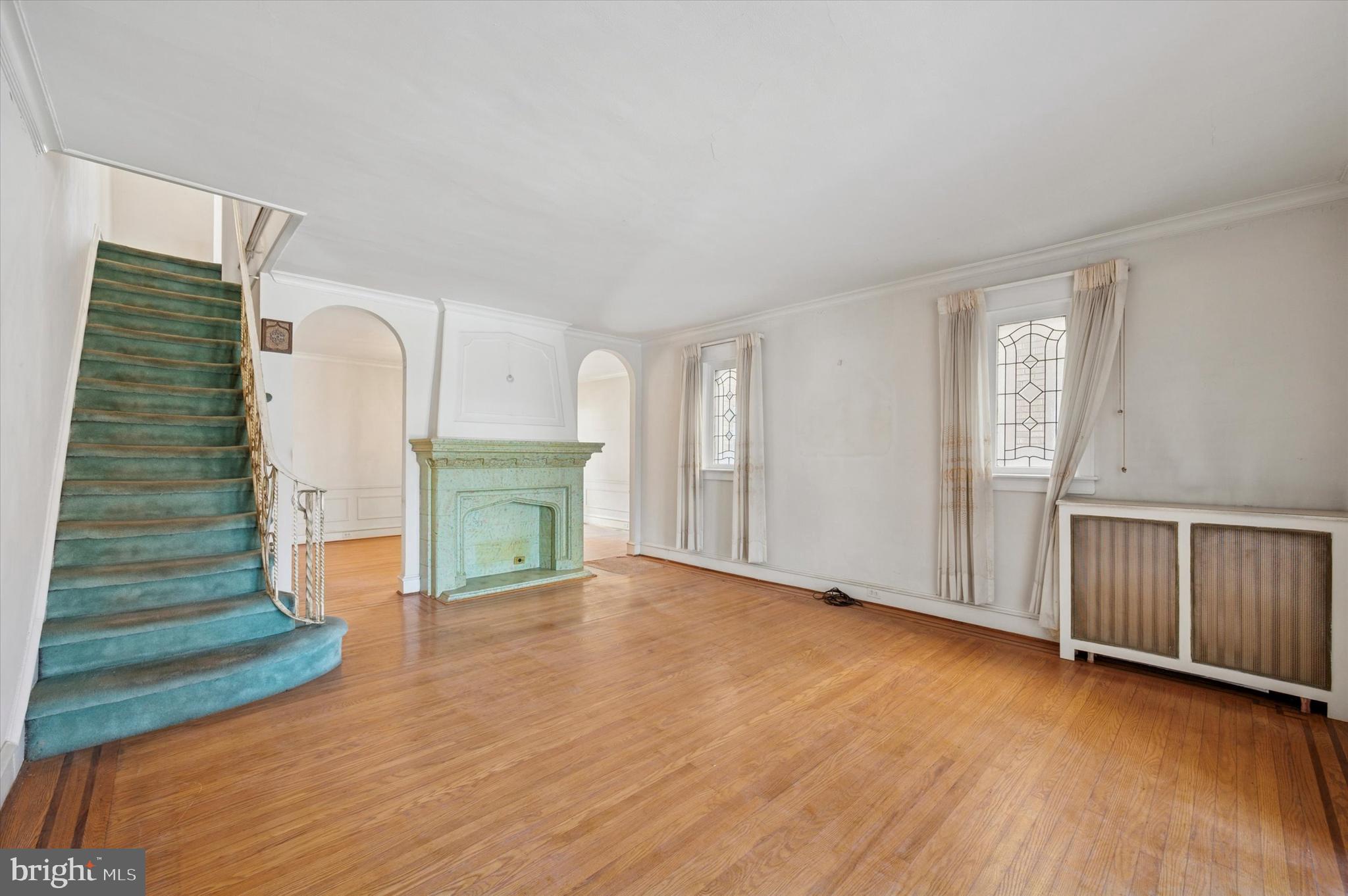 262 Bayard Road Upper Darby, PA 19082 - Photo 6 of 25 a view of an empty room with a fireplace