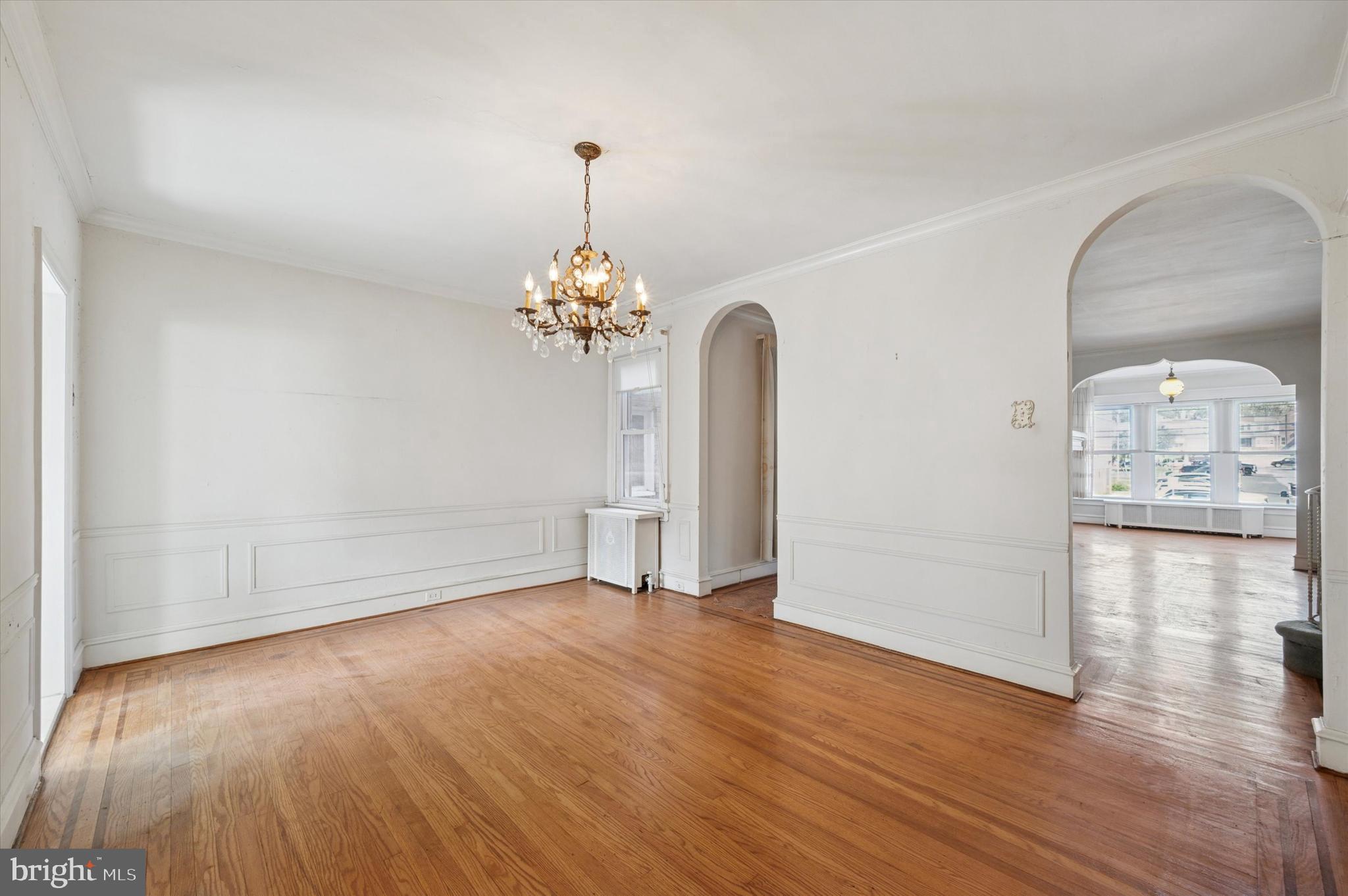 262 Bayard Road Upper Darby, PA 19082 - Photo 9 of 25 a view of a room with wooden floor and chandelier