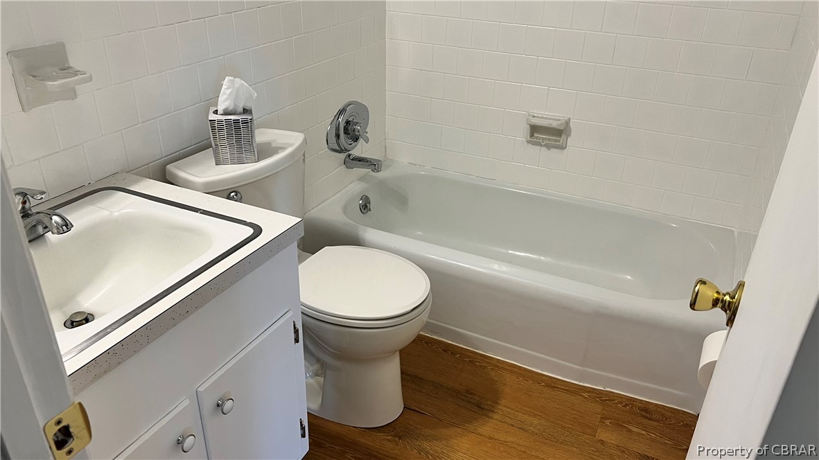 8121 Glass Road Hayes, VA 23072 - Photo 15 of 23 Hall Bathroom - New floor, freshly painted and new tub/shower fixture