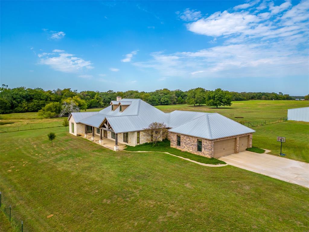 453 Tower Road Valley View, TX 76272 - Photo 11 of 38 a view of a house with a big yard and large tree