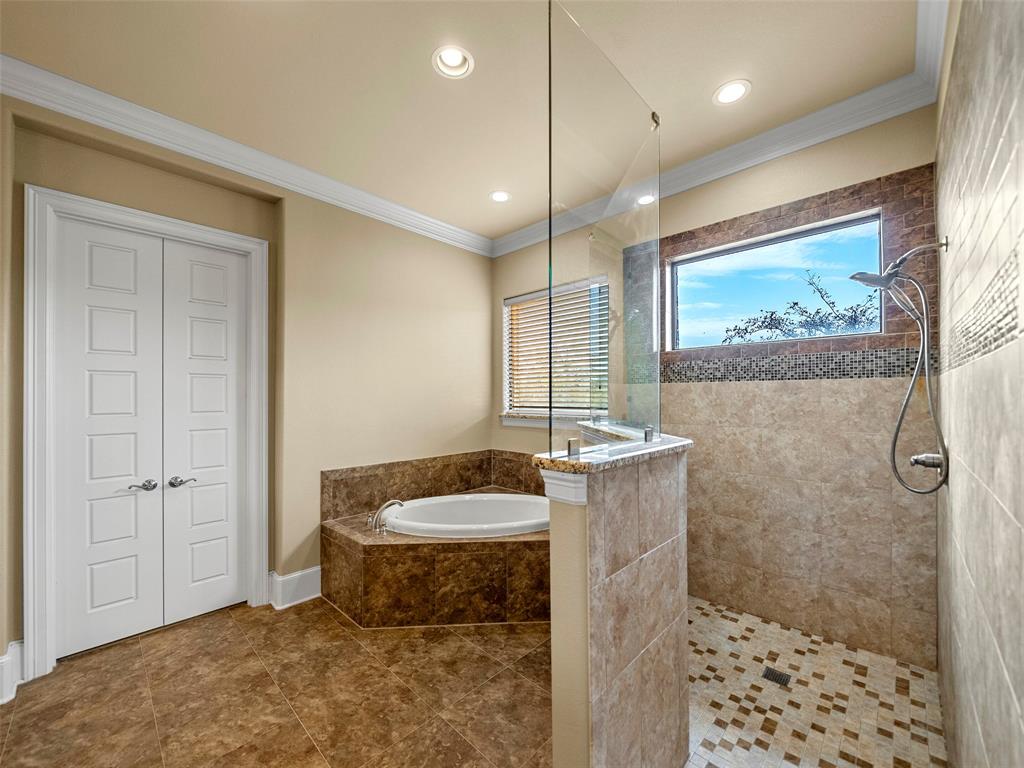 453 Tower Road Valley View, TX 76272 - Photo 23 of 38 a bathroom with a granite countertop sink a toilet a shower and a mirror