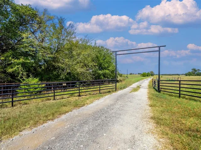 a view of swimming pool with a yard