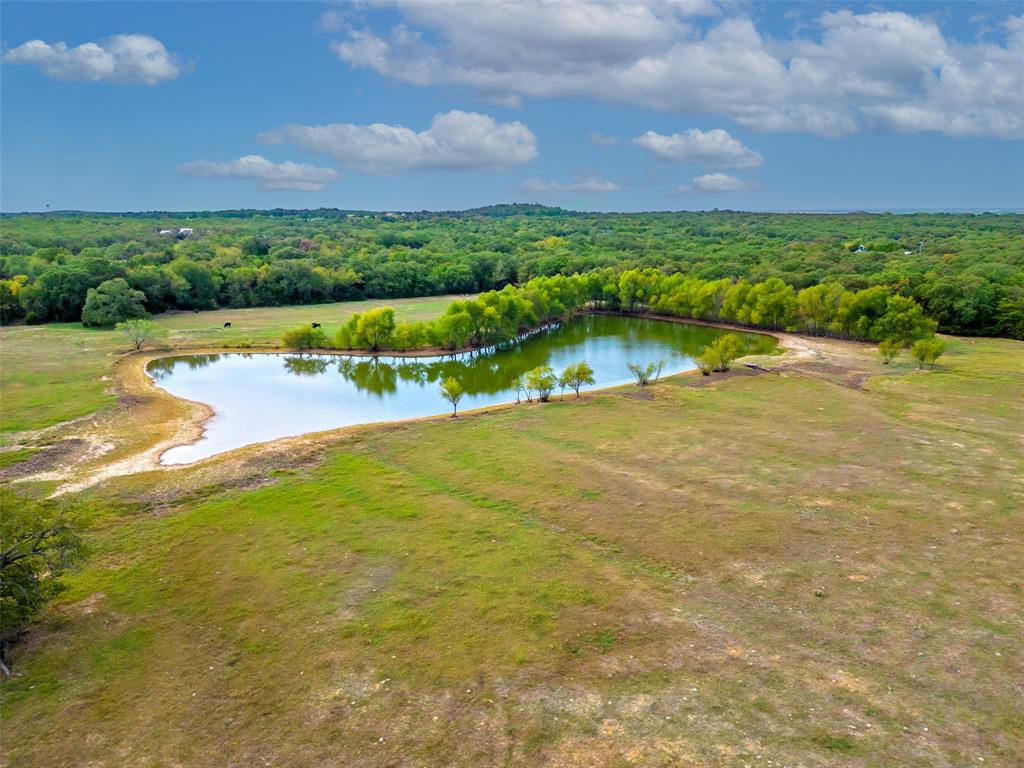 453 Tower Road Valley View, TX 76272 - Photo 30 of 38 a view of a lake with houses in the back
