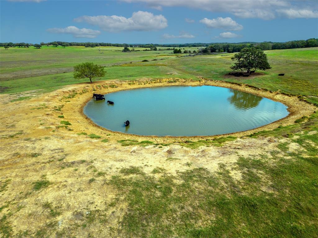 453 Tower Road Valley View, TX 76272 - Photo 33 of 38 a view of a swimming pool with a yard