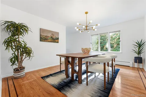 a view of a dining room with furniture window and wooden floor