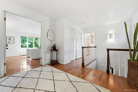 a view of living room filled with furniture and wooden floor