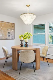 a dining room with furniture and window