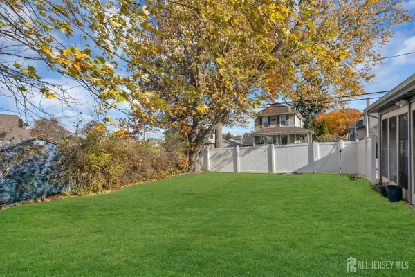 a view of a house with a back yard