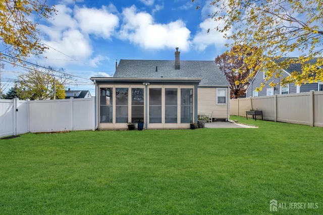 a view of a house with a backyard