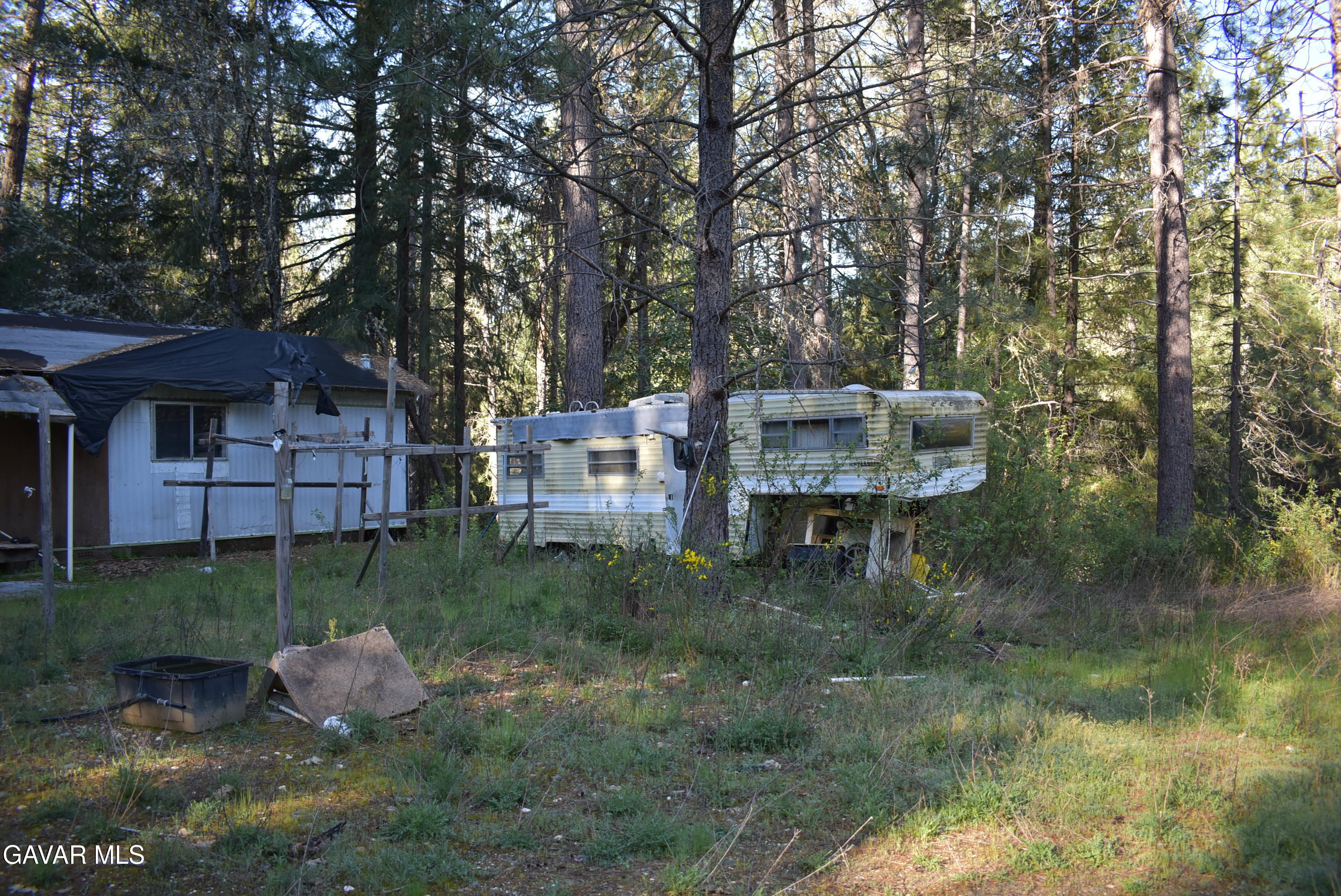 14550 Grizzly Hill Road Nevada City, CA 95959 - Photo 35 of 53 a backyard of a house with table and chairs