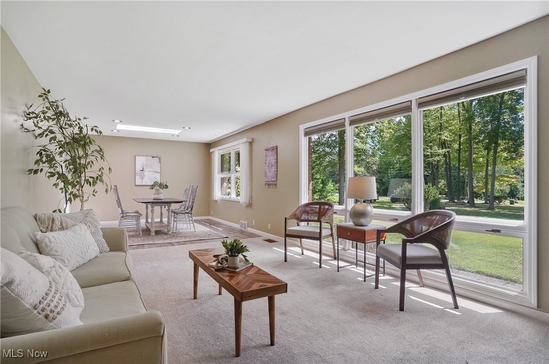 4555 Ranchwood Road Akron, OH 44333 - Photo 11 of 43 Living room with carpet flooring and baseboards