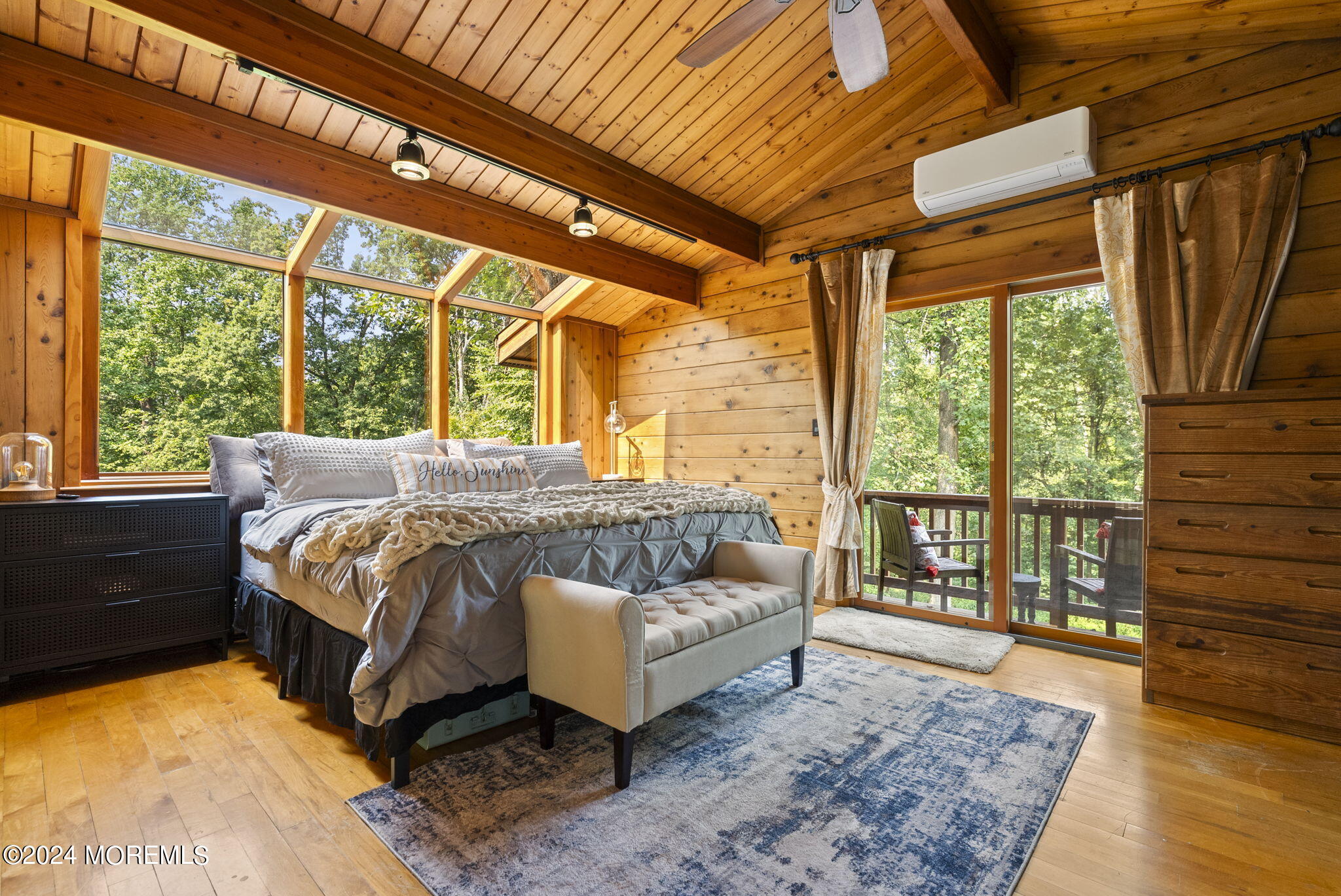 151 Summerfield Road Belvidere, NJ 07823 - Photo 19 of 41 a bedroom with a bed couch and wooden floor