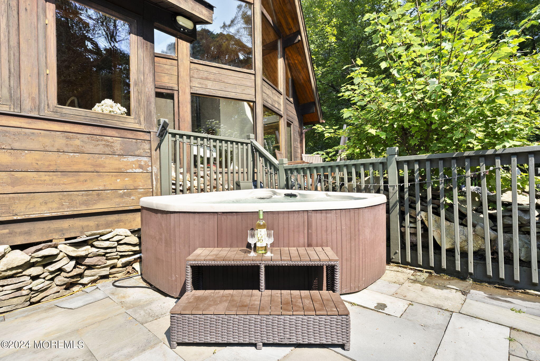 151 Summerfield Road Belvidere, NJ 07823 - Photo 25 of 41 a view of a brick house with a large window and wooden fence