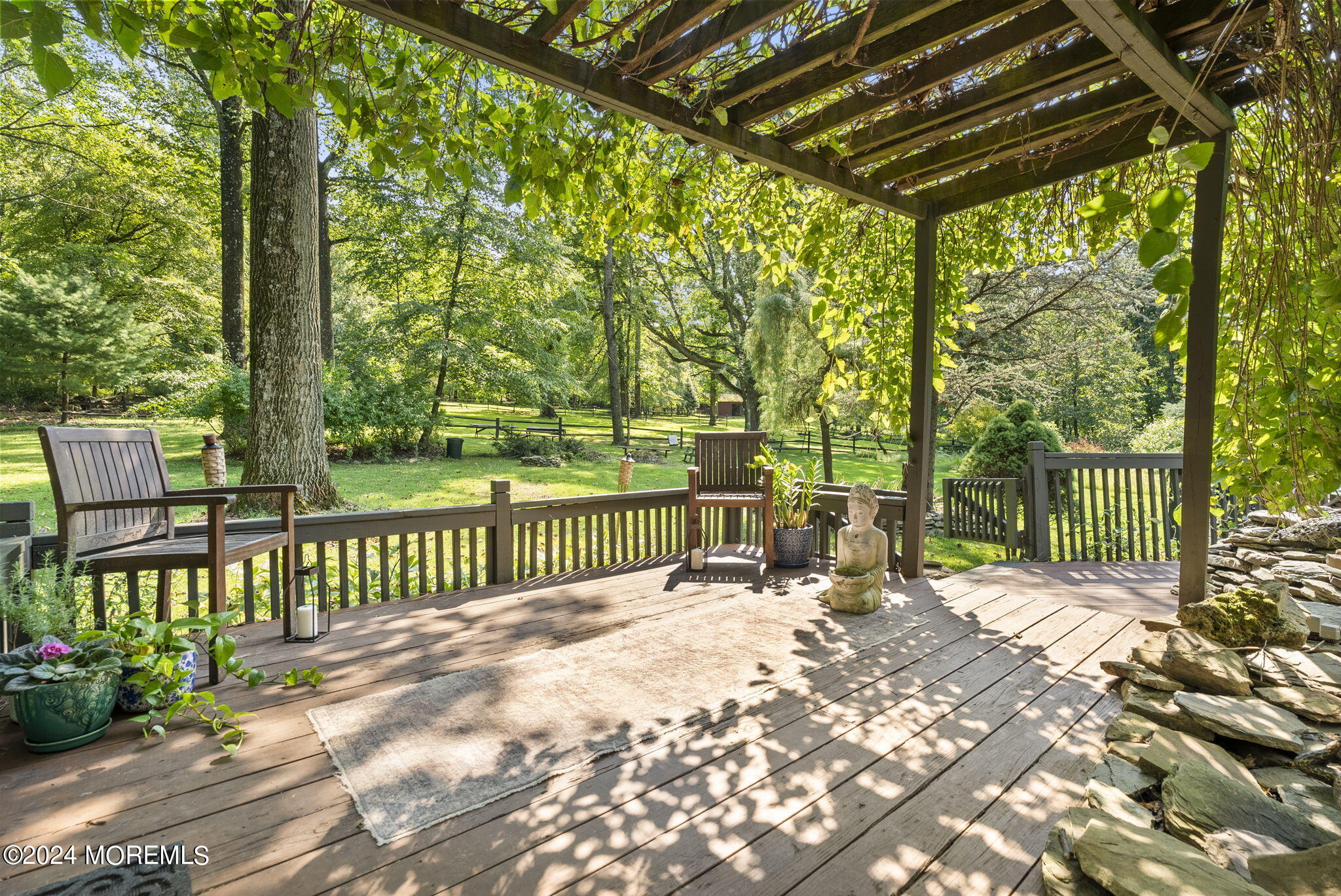 151 Summerfield Road Belvidere, NJ 07823 - Photo 27 of 41 a view of a patio with a table chairs and a backyard