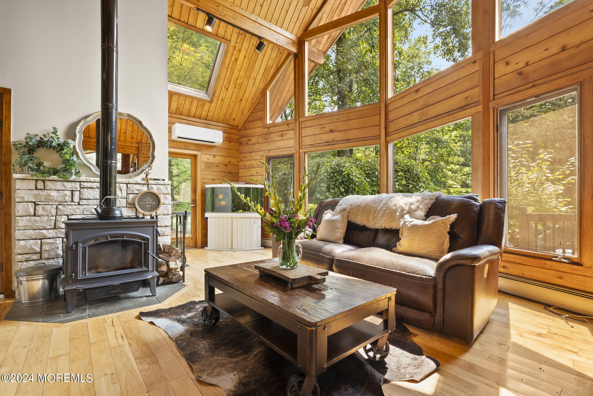 151 Summerfield Road Belvidere, NJ 07823 - Photo 9 of 41 a living room with furniture a fireplace and a floor to ceiling window