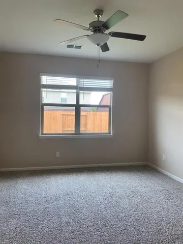 a bathroom with a granite countertop sink and shower