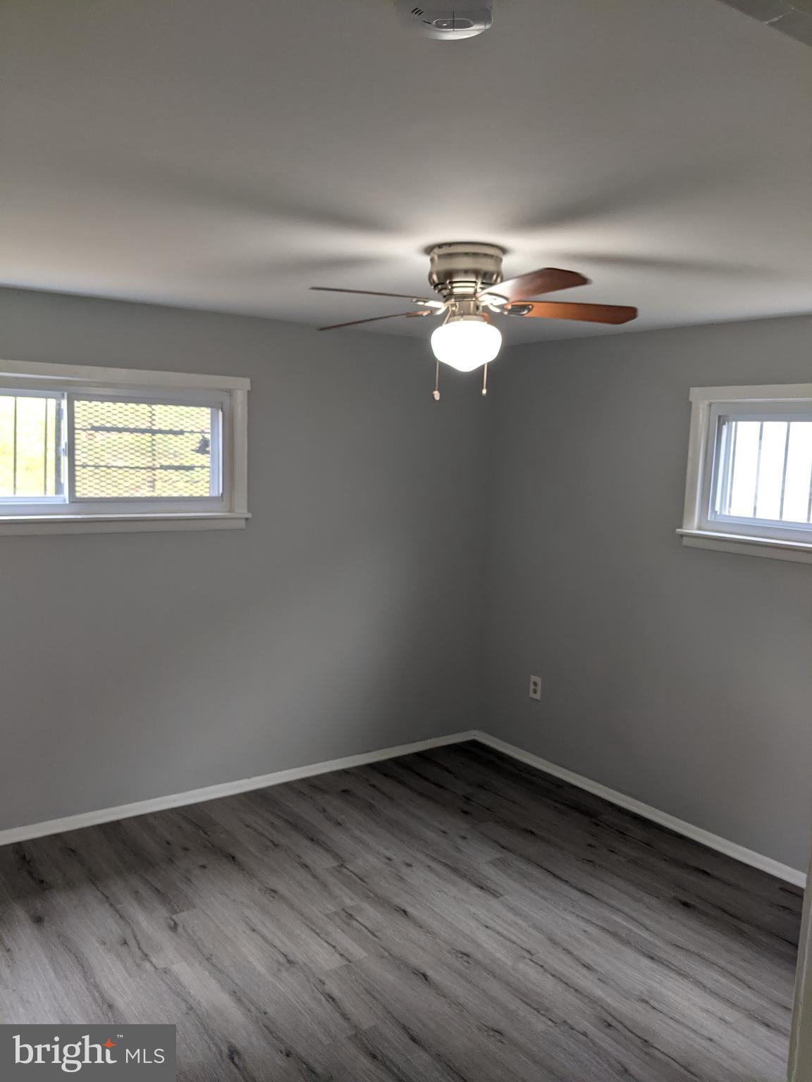 4616 Heath Street, Unit B Capitol Heights, MD 20743 - Photo 12 of 25 wooden floor in an empty room with a window