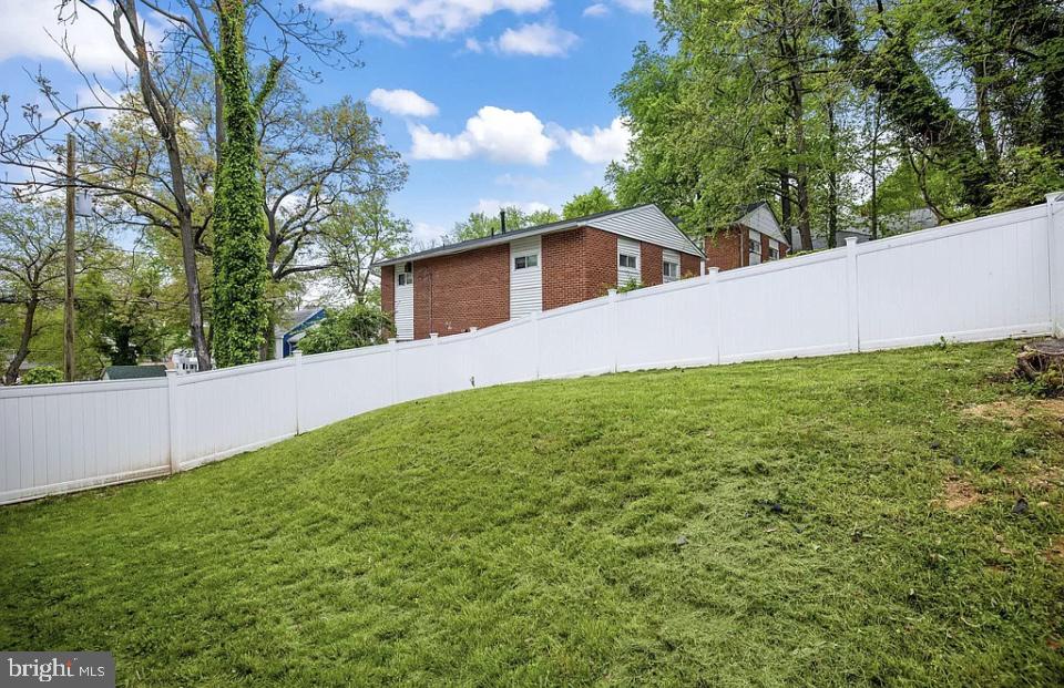 4616 Heath Street, Unit B Capitol Heights, MD 20743 - Photo 15 of 25 a front view of a house with garden