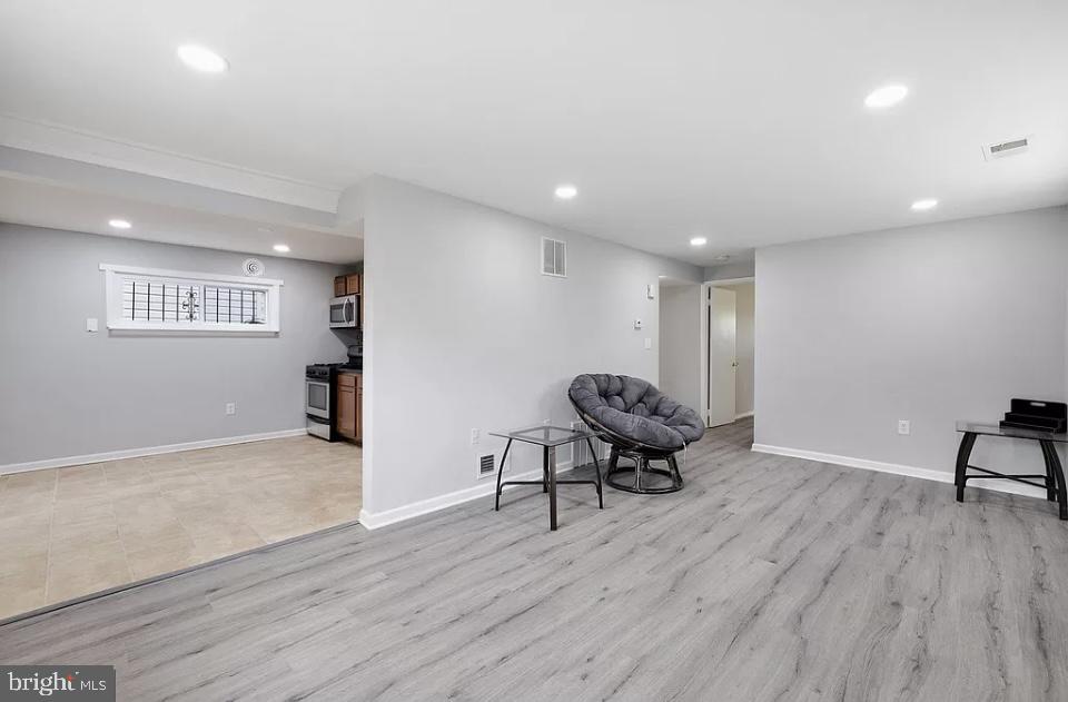 4616 Heath Street, Unit B Capitol Heights, MD 20743 - Photo 23 of 25 a view of a room with wooden floor and furniture