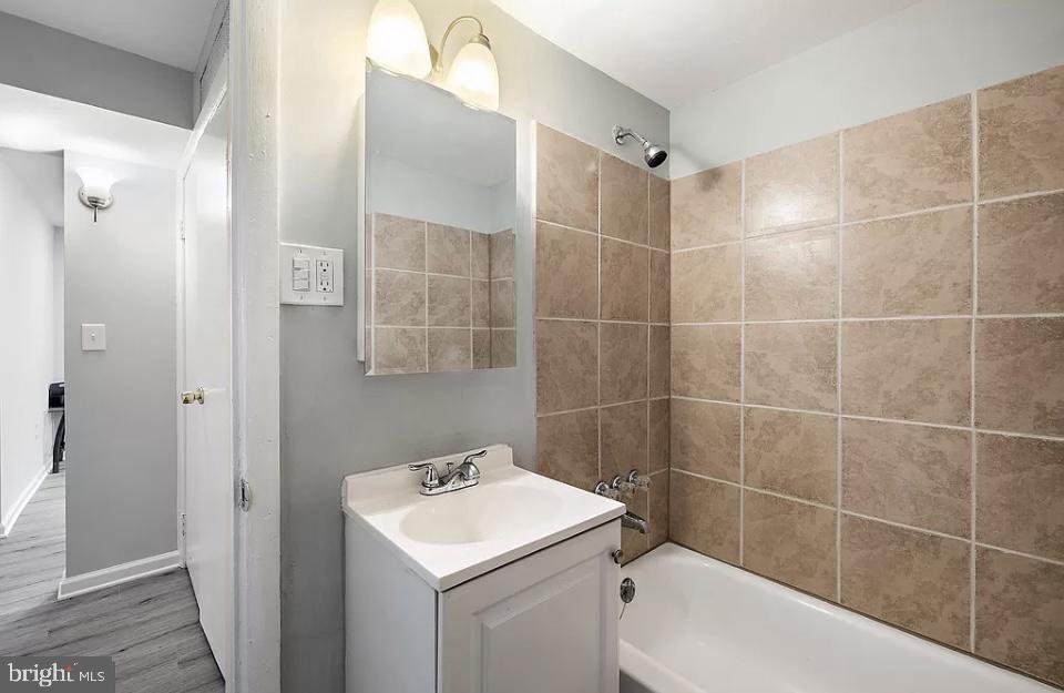 4616 Heath Street, Unit B Capitol Heights, MD 20743 - Photo 6 of 25 a bathroom with a sink toilet and shower