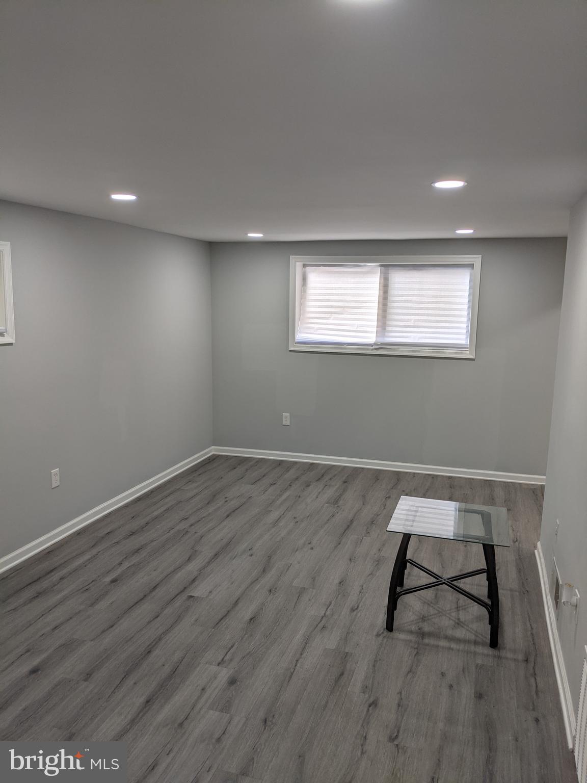 4616 Heath Street, Unit B Capitol Heights, MD 20743 - Photo 7 of 25 wooden floor in an empty room with a window