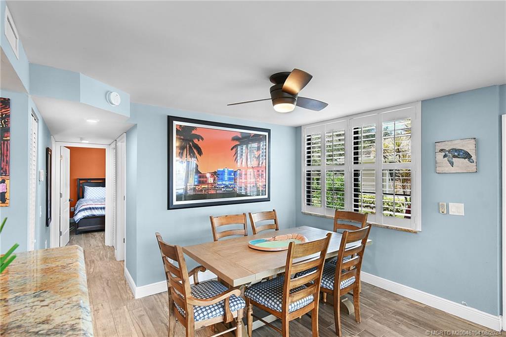 311 Golfview Circle Stuart, FL 34996 - Photo 11 of 37 a view of a dining room with furniture and chandelier