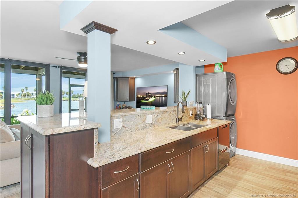 311 Golfview Circle Stuart, FL 34996 - Photo 14 of 37 a bathroom with a granite countertop sink and a mirror