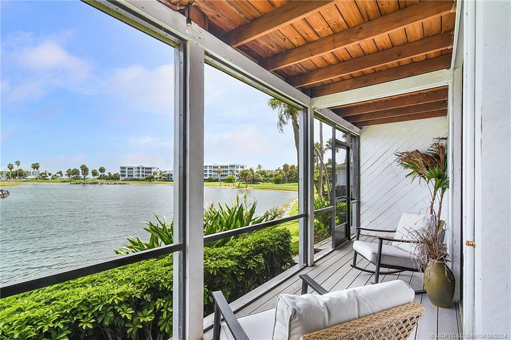 311 Golfview Circle Stuart, FL 34996 - Photo 25 of 37 a view of balcony with furniture and garden